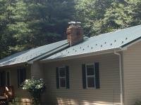 24' x 30' x 9' garage addition on house with new metal roofing to match on house